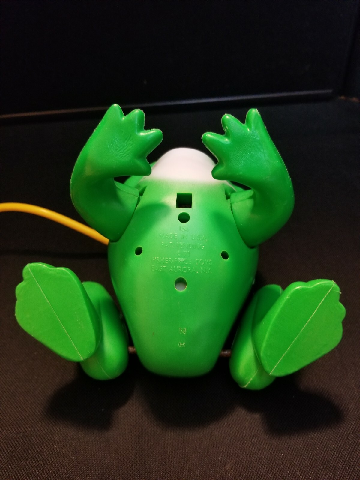 squeeze bulb jumping frog toy
