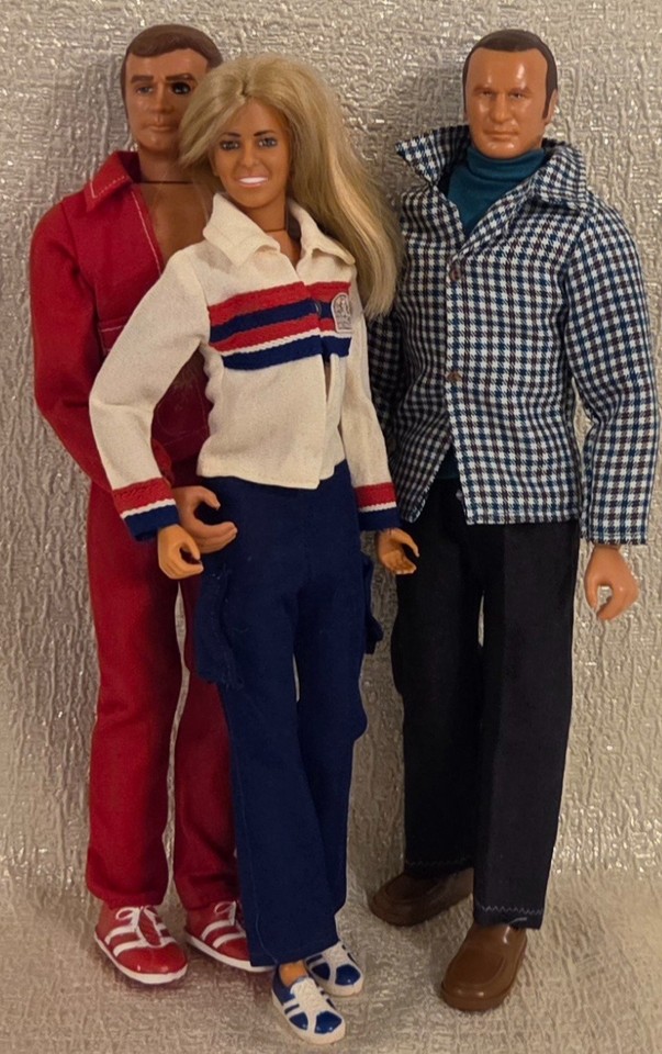 A trio of 70s Bionic Woman, Six Million Dollar Man, and Oscar Goldman dolls with accessories — an intact set from peak 70s TV cool.