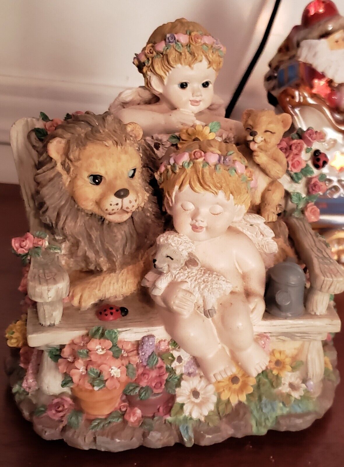Classic Treasures Cherub Music Box Cherub holding a lamb, lion, bear and ladybug