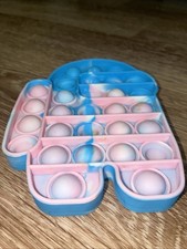 This item is an "Among Us" character-themed silicone pop-it fidget toy