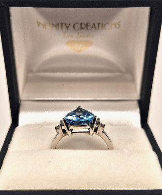 14K White Gold Ring with 3.50 ct. Trillion Cut Blue Topaz & 6 Diamonds 0.14 ct.