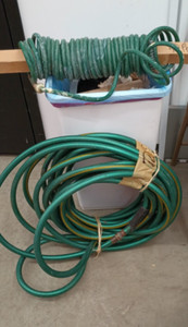 2 Garden Hoses 40 Foot Coil and 74 Foot Regular No Major Leaks Pick up only
