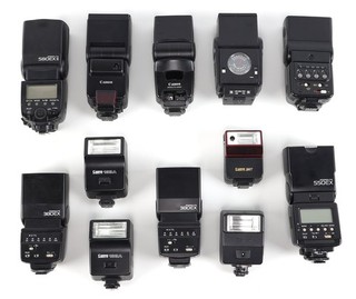 Lot of (12) Canon Brand Shoe Mount Flashes (Various Models) UNTESTED