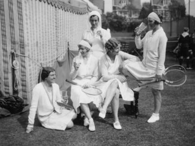Female tennis players relax outside drinks after their matches Mid Old Photo