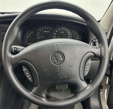 COMMODORE GENUINE GMH VT  VX  VU  BLACK STEERING WHEEL ,WITH RADIO SWITCHES. A1