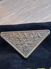 NEW PRADA PIN BADGE/ BROOCH & POUCH.DYMONIQUE USED SILVER,HAT,BAG,DRESS.