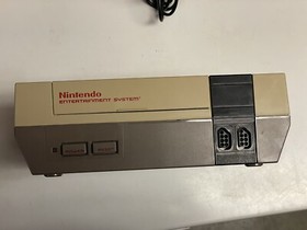 Nintendo NES console bundle with controllers, zapper, and games Tested