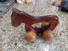 vintage wooden toy horse with wheels and a rope tail. 1920s-1940s