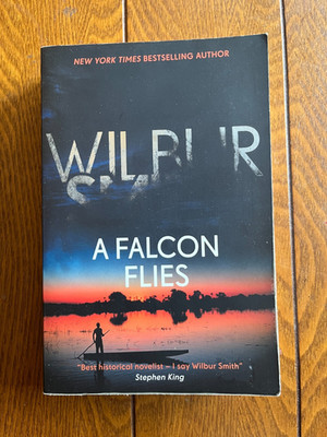 A Falcon Flies by Wilbur Smith (2018, Trade Paperback,) Good Condition