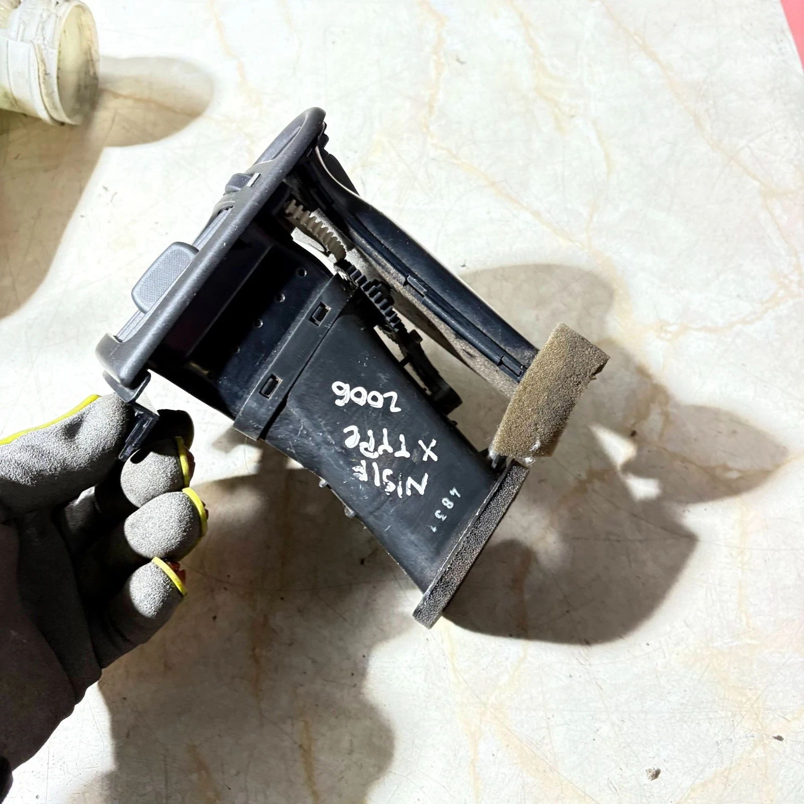 Actual Jaguar X-Type passenger dashboard air vent - rear and donor marking