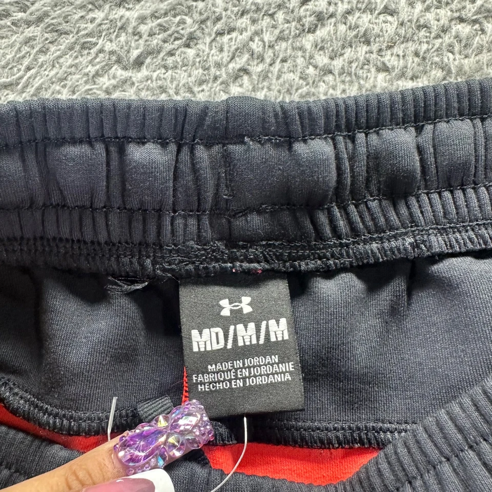 Pantalones deportivos Under Armour para hombre medianos naranja poliéster elástico ajuste cónico Foto 3 de 4