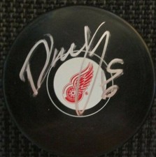 DANNY DEKEYSER SIGNED DETROIT RED WINGS HOCKEY PUCK  w/ COA