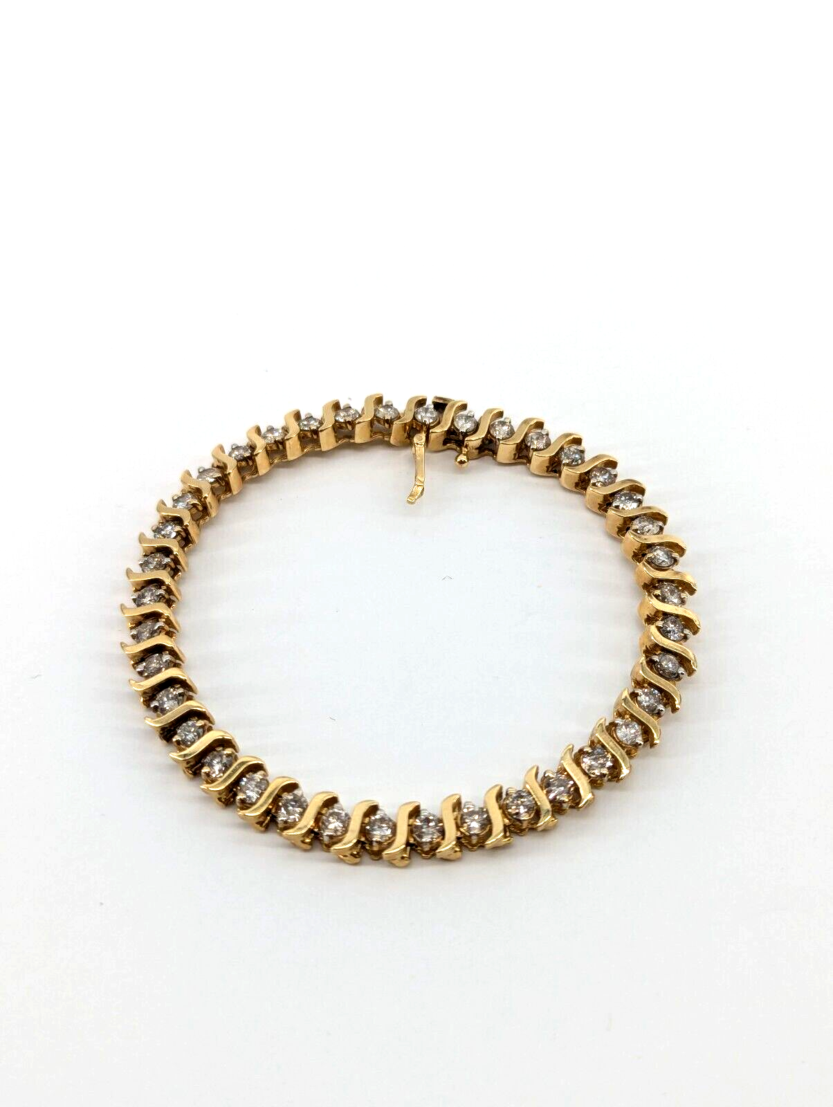14kt yellow gold, 15.50 grams, 3.0cttw Diamond tennis bracelet