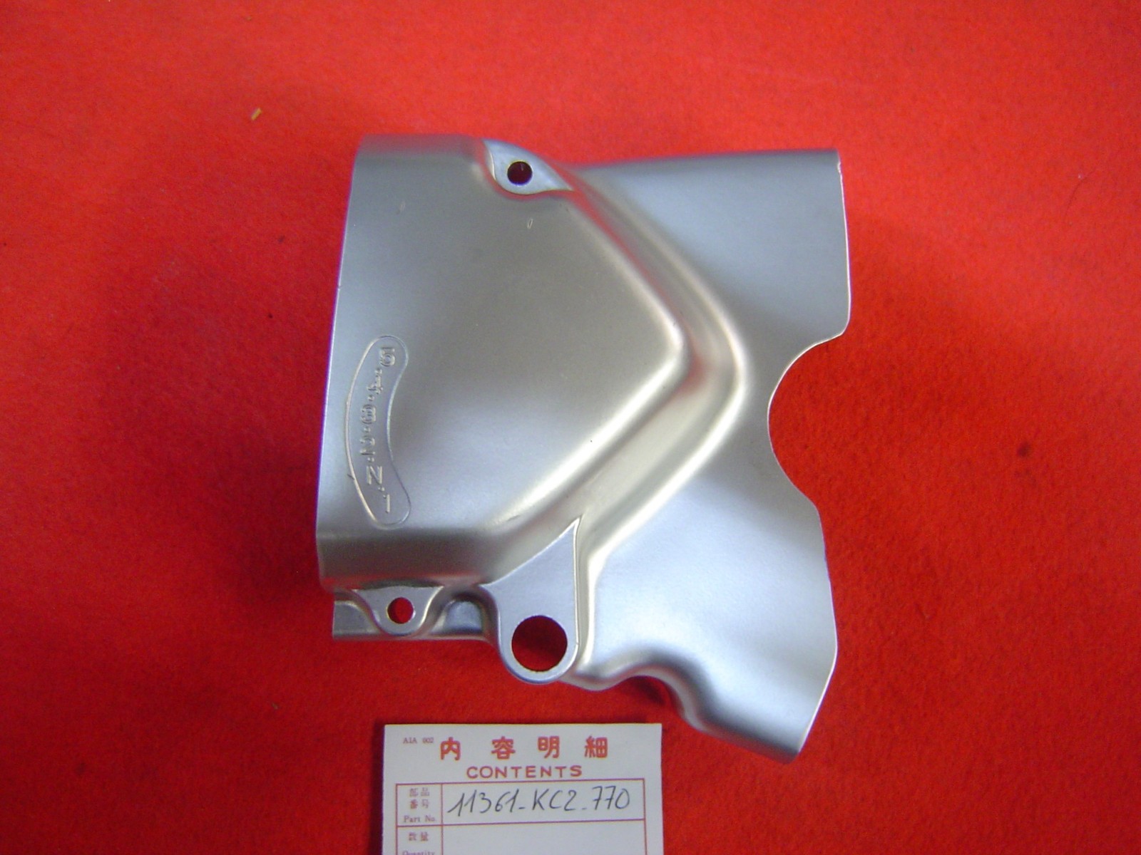 Carter pignon sortie boite CM125C 88/89 en alu d'origine pour moto Honda