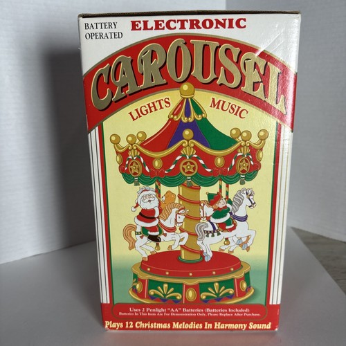 VINTAGE ELECTRONIC CHRISTMAS MUSICAL CAROUSEL -PLAYS 12 TUNES- W/ BOX - Picture 2 of 6