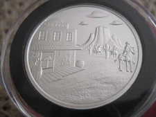 2 OZ UFO'S OVER COWBOYS IN BLACK RING CAPSULE