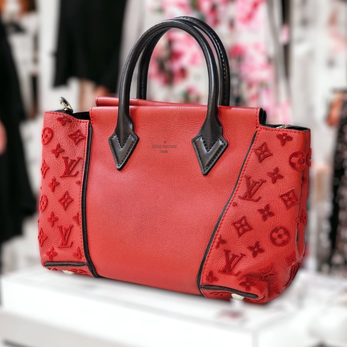 red and black lv bag