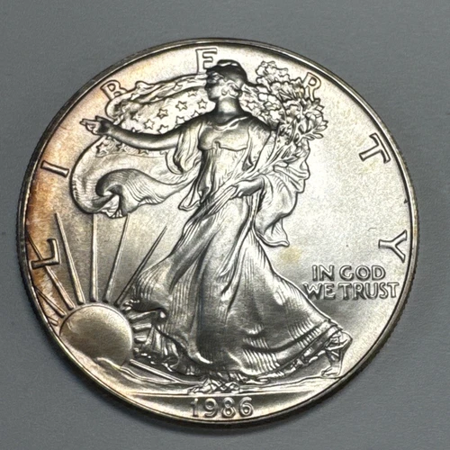 1986 $1 American Silver Eagle Gem Uncirculated Rainbow Toning.