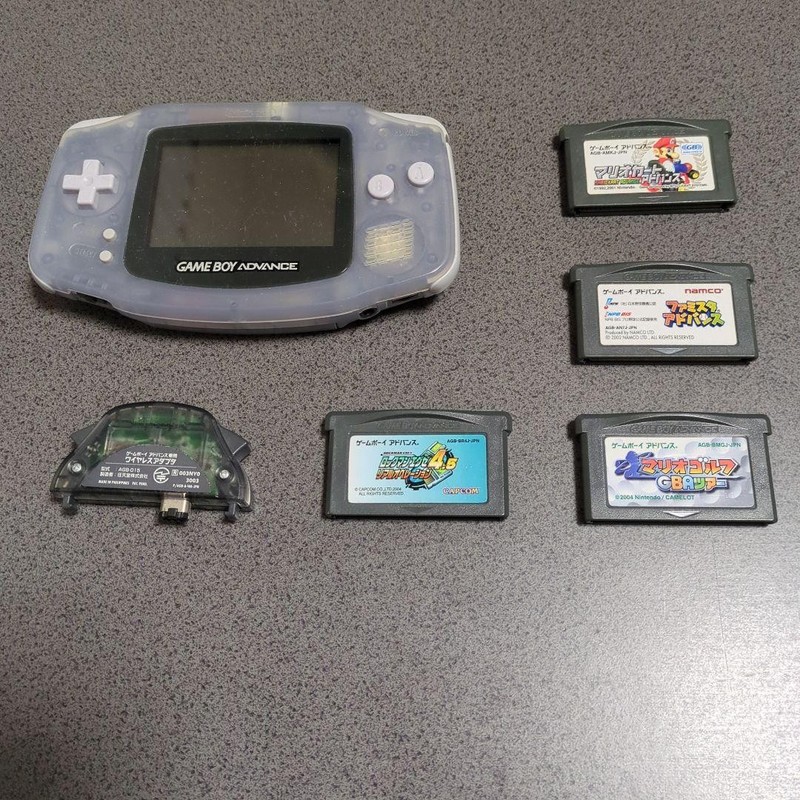 Nintendo Game Boy Advance Clear with 4 Games & Wireless Adapter Used