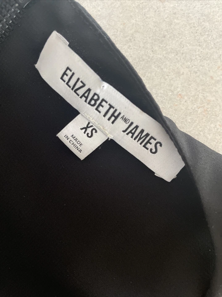 Camiseta sin mangas Elizabeth and James en capas XS satinada carrera minimalista negra Foto 4 de 4