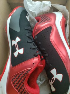 red and black under armour baseball cleats
