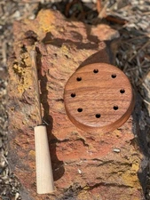 made from walnut with slate over glass. Striker is 2 piece Bocote wood.