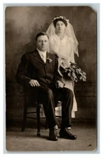 Vintage 1910's RPPC Postcard Studio Portrait of Newlywed Couple with Flowers