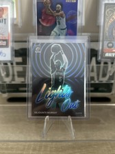 2022-23 Donruss Optic Lights Out Blue #7 Dejounte Murray /49 - Atlanta Hawks