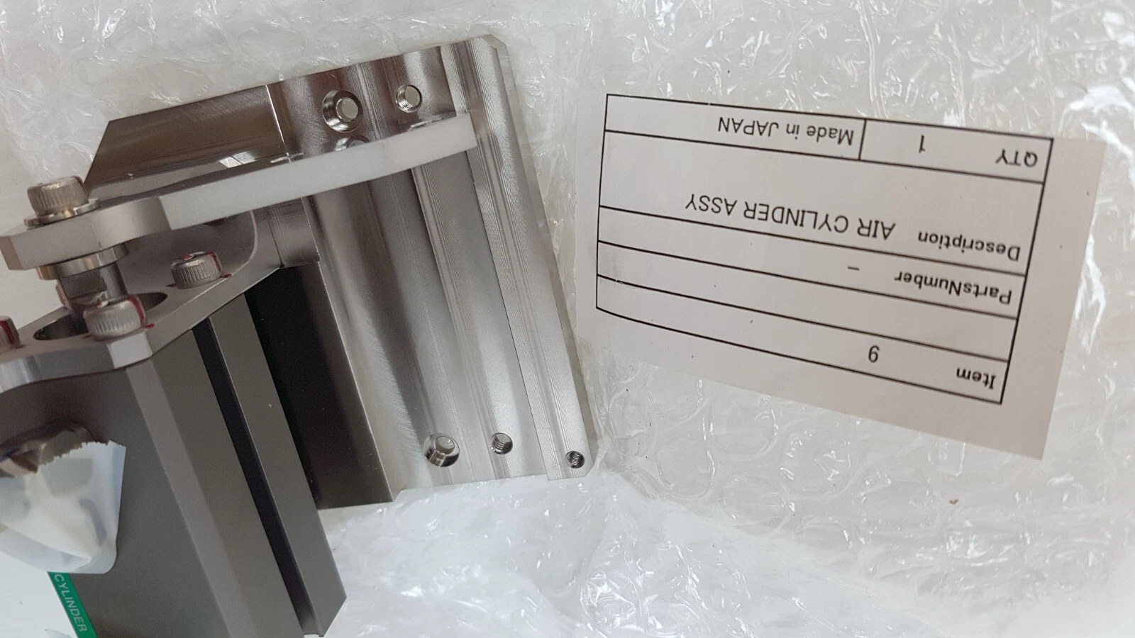 Air cylinder assembly with its item label: item 9, AIR CYLINDER ASSY, qty 1