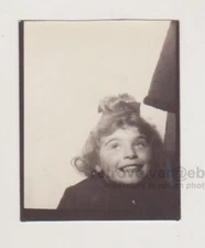 Playful Young Girl Unleashes Fun in the Photo Booth Snapshot Abstract Unusual