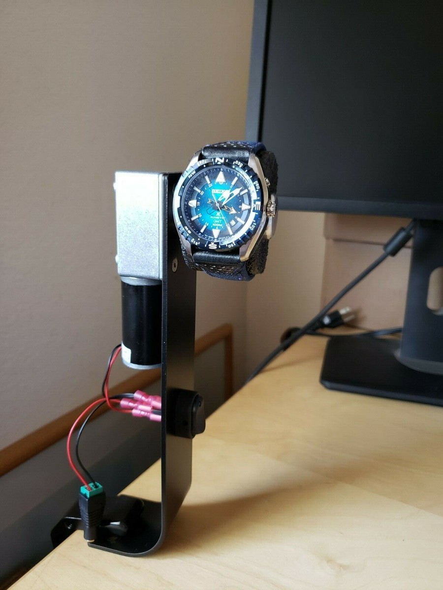 Unique Seiko kinetic watch winder with narrow-profile clamp Unique Seiko kinetic watch winder with narrow-profile clamp