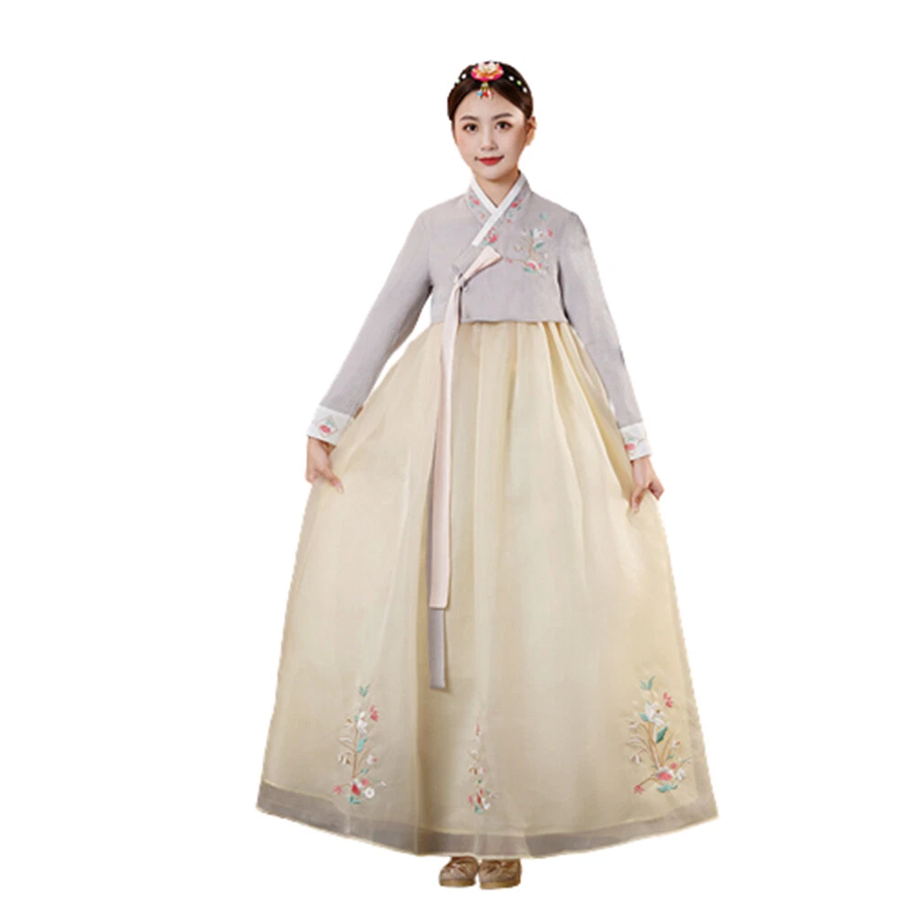 Hanbok, the traditional Korean dress and beautiful Asian girl with sakura  17738622 Stock Photo at Vecteezy