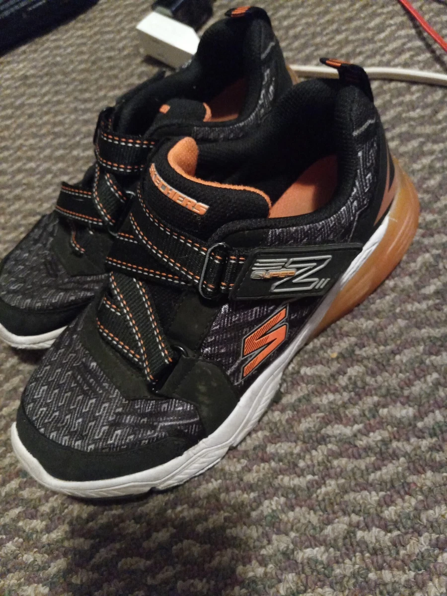 Skechers black cheap and orange