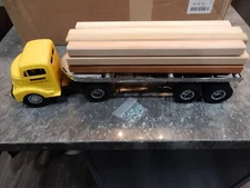SMITH MILLER GMC  LUMBER TRUCK IN YELLOW  NEW IN THE BOX FACTORY ISSUE
