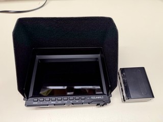 FEELWORLD FW759 7" ON FIELD HD MONITOR W/ BATTERY WORKING NICE SUNSHADE