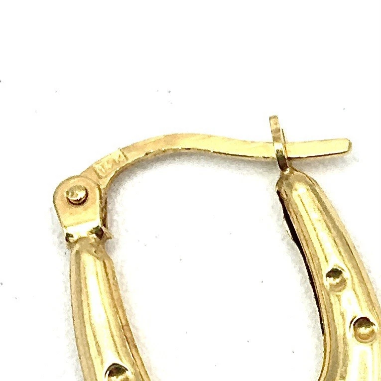Pendientes mini aros ovalados herradura oro amarillo 14K con puntos cierre francés gitano Foto 3 de 4