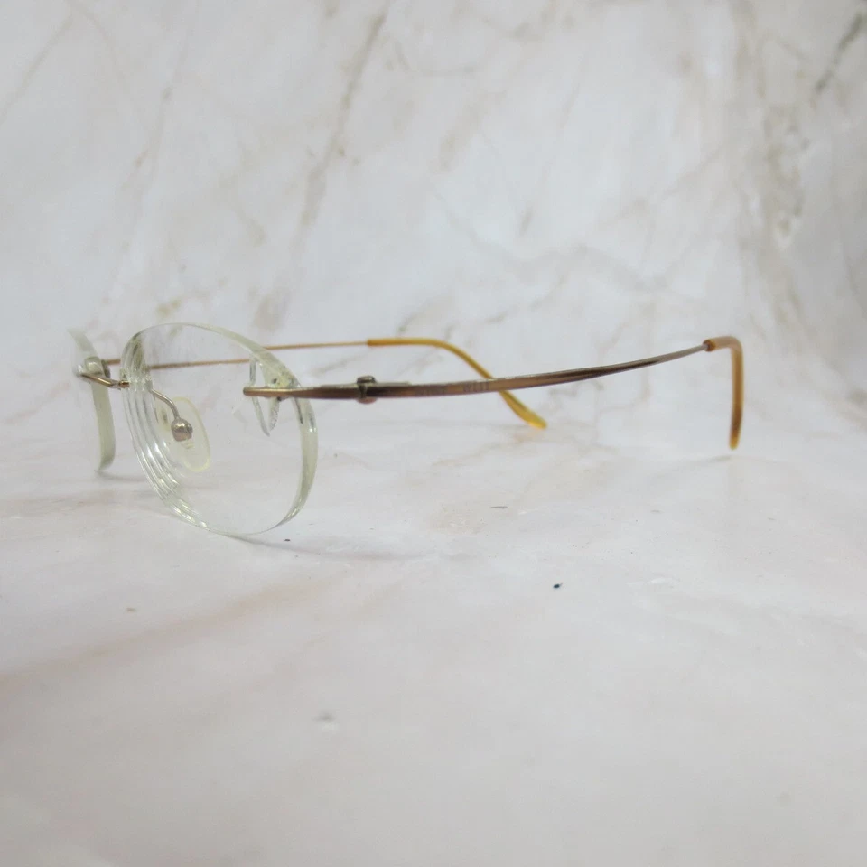 Marco de gafas Nine West 58 0P1F para mujer metal dorado sin montura ovalado 47-18-135 Foto 2 de 4