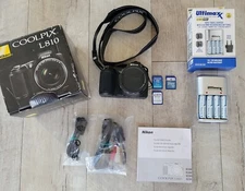 NWOT Nikon COOLPIX L810, package deal, charger, batteries, 3 memory cards