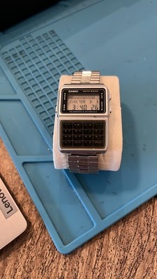 Casio DBC-610 Data Bank 676 Telememo Calculator Silver Digital Watch