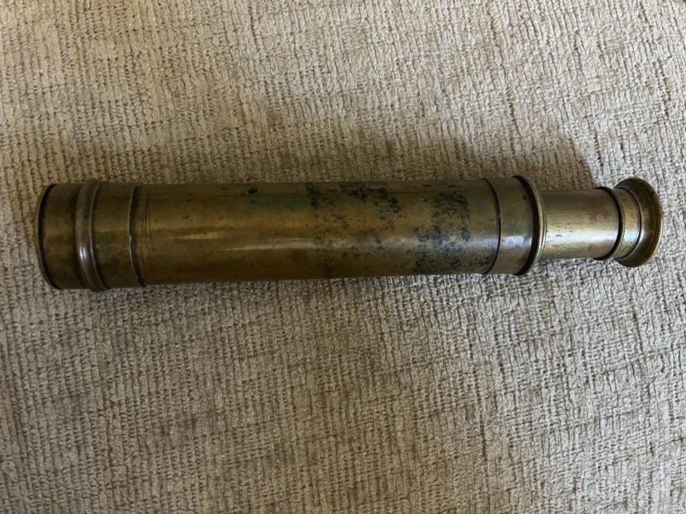 A four-draw brass maritime spyglass that looks like it belongs on a 19th-century tall ship — functional, gorgeous, and undeniably cool on a bookshelf.