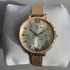 Image of Olivia Burton ladies rose gold colour watch with mesh strap.