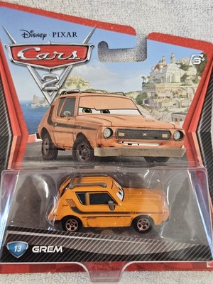Mattel Disney Pixar Cars 2 Grem #13 1:55 Orange Diecast Unopened Box 2010