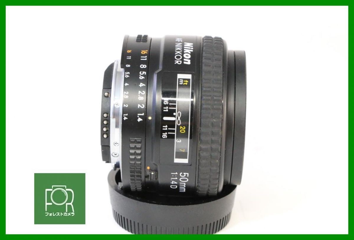 Nikon AF NIKKOR 50mm F1.4D with front and rear caps and filters