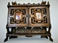 Antique German black forest wood carved apothecary wall cabinet man lady fig