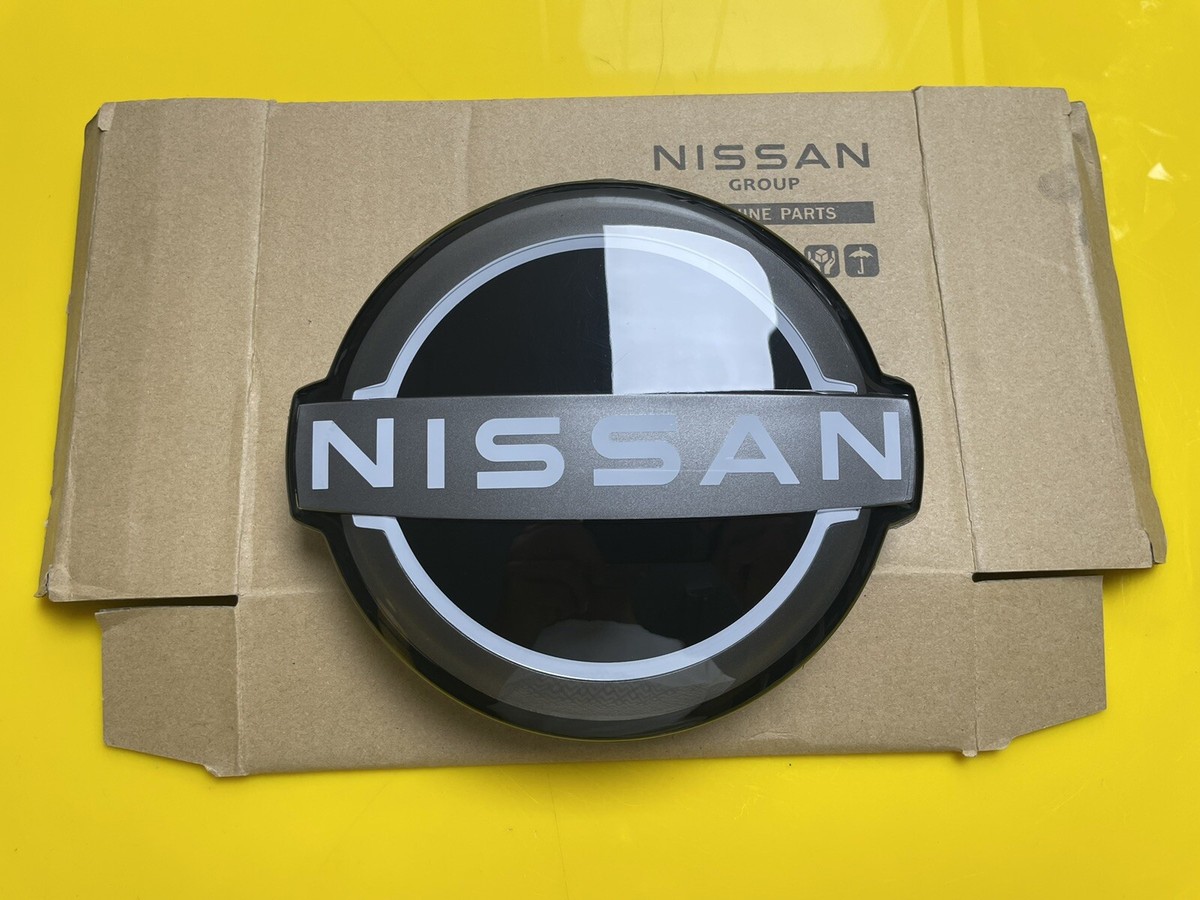 Nissan Rogue Front Grille Emblem 2021-2023 - New Style Outline Badge | Part #62890-6RM0A, Chrome & White