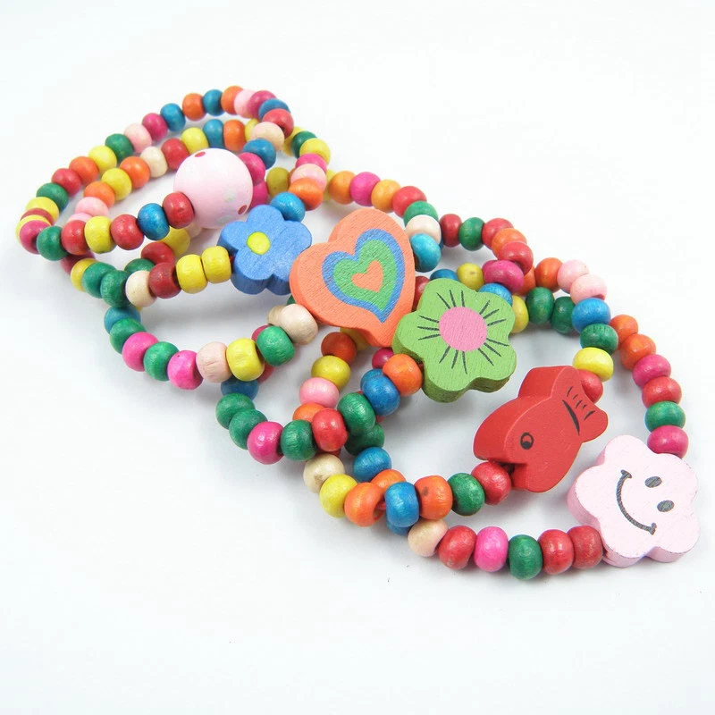 24x Mezcla Madera Elástica Niños Cuentas Pulseras Niños Fiesta Bolsa Rellenos Joyería Lotes Foto 3 de 4