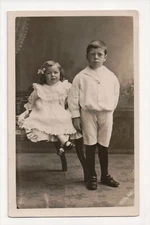 E-730 Darling Little Girl with Bow and Boy Studio Real Photo RPPC Postcard