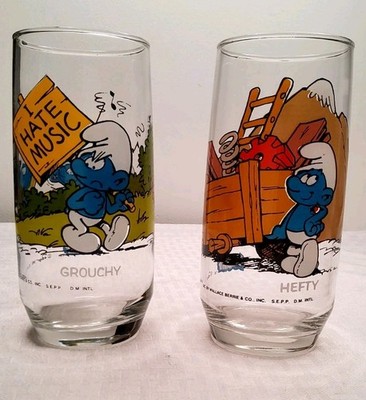 2 Vintage  Smurf Glasses,  Grouchy And Hefty. 1982, 6 In. Tall Ni Chips, (121)