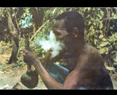 ETHNIC (GUINEA-BISSAU Portuguese) INDIGENOUS MAN smoking circa 1960