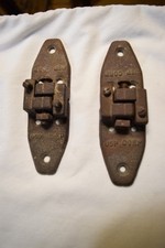 Two vintage cast iron joint fasteners